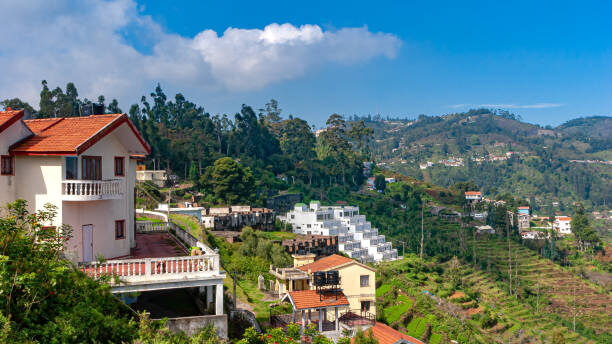 Kodaikanal, India - November 09, 2007: The South Indian hill station and summer resort of Kodaikanal in the state of Tamil Nadu.  Some local buildings of the town can be seen.   Some areas are covered with natural forest with a variety of trees including eucalyptus and pines